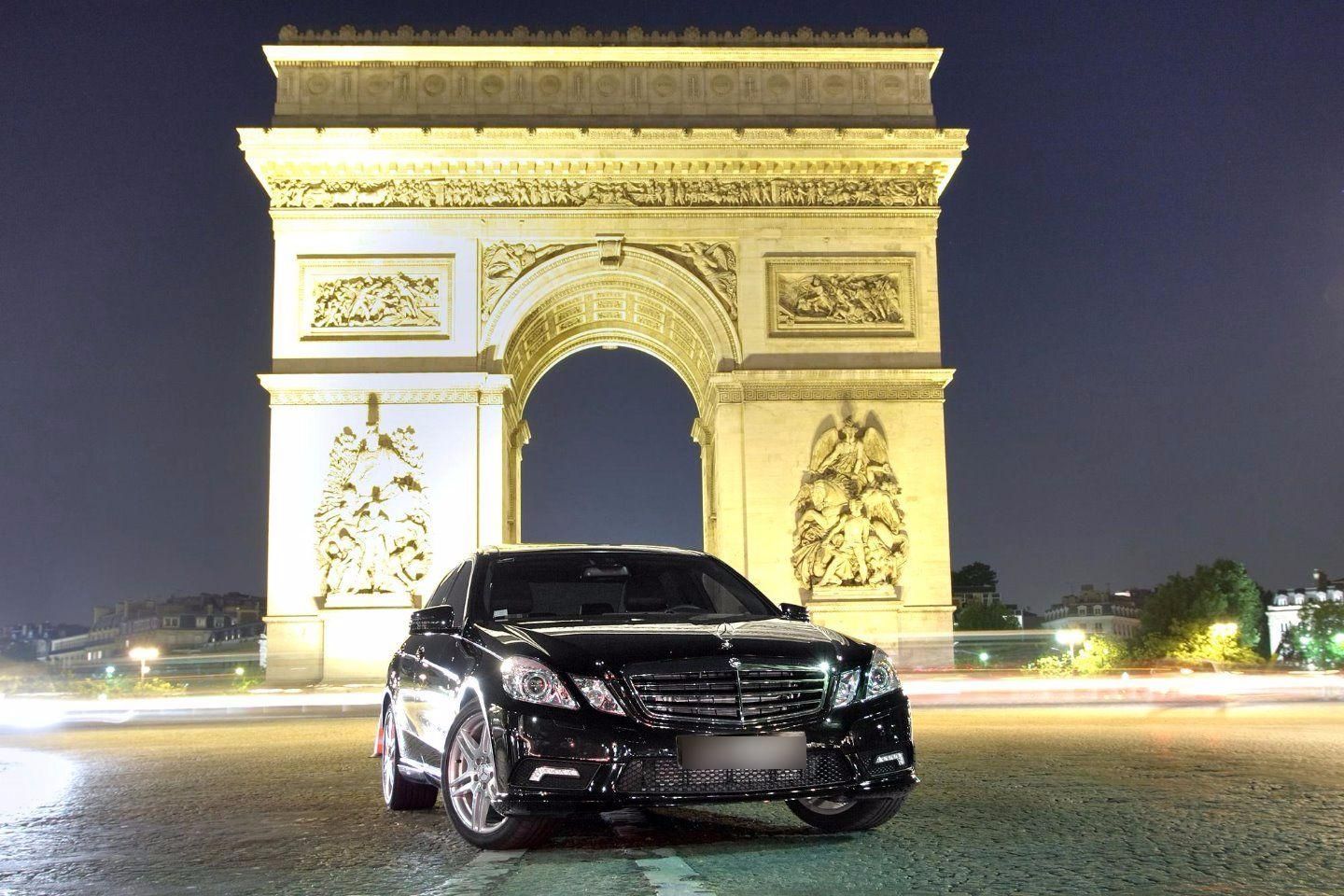 Mercedes S-Class luxury vehicle driving along Champs-Élysées avenue