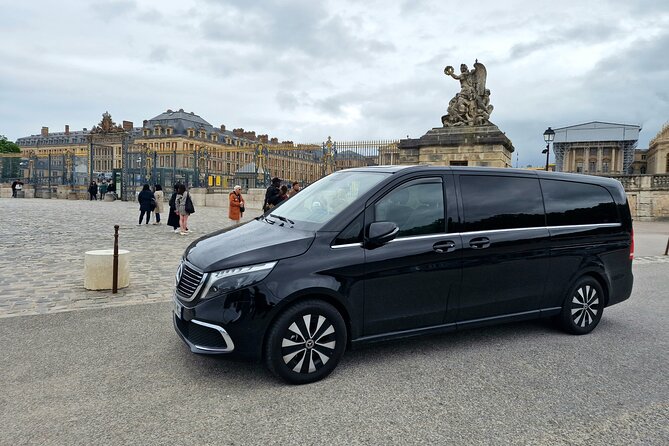 Executive Mercedes van near the gates of Château de Versailles